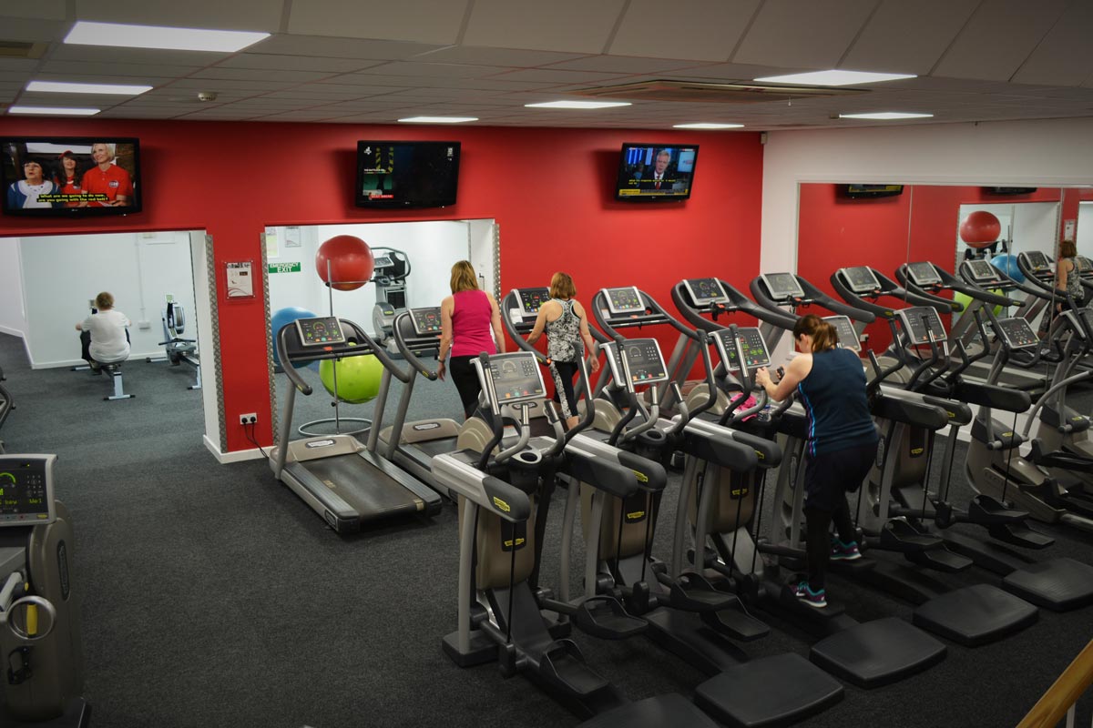 Gym flooring with fitness machines